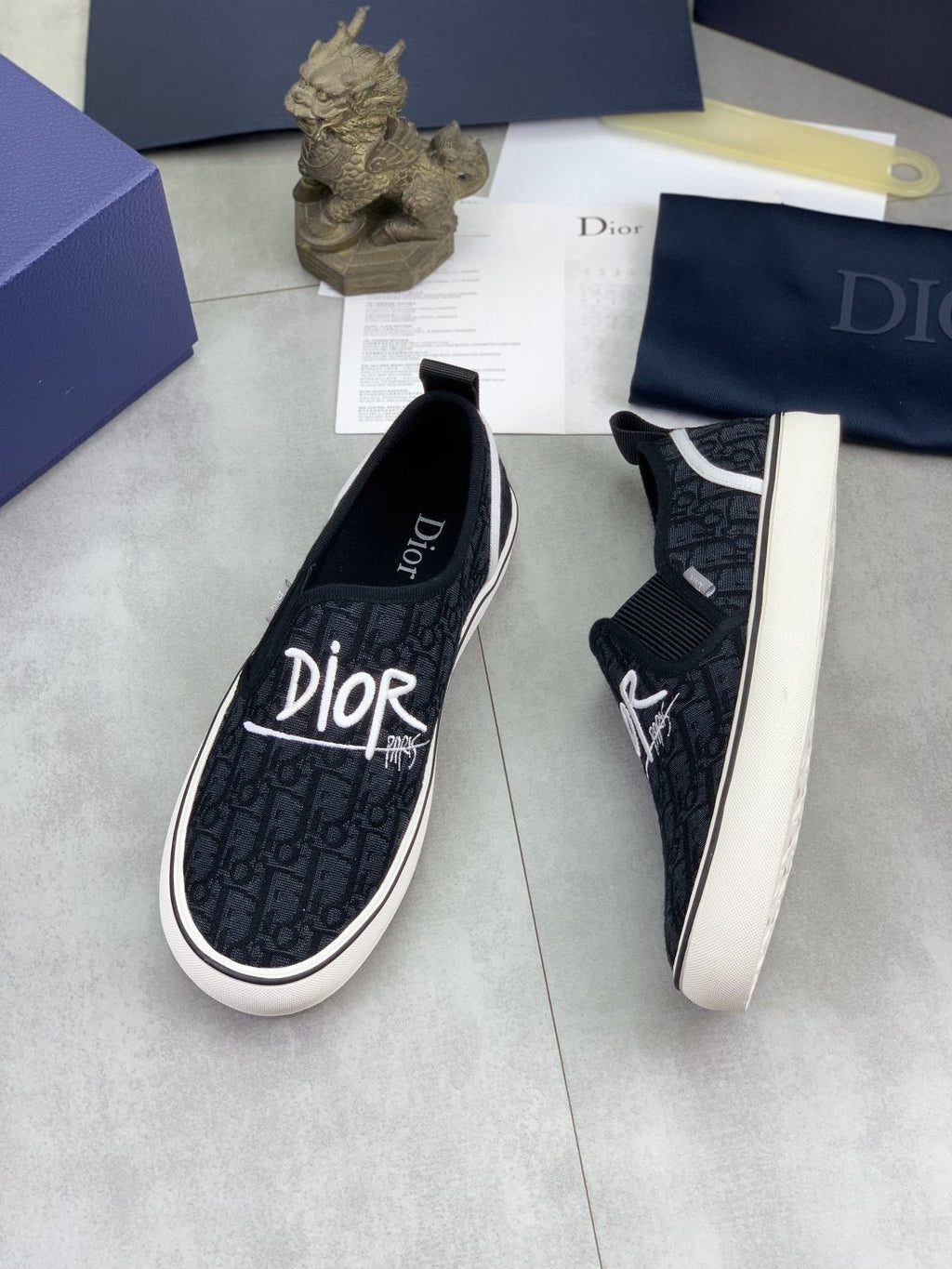 Dior Logo-Pattern Canvas Slip-On Sneakers - Black and White